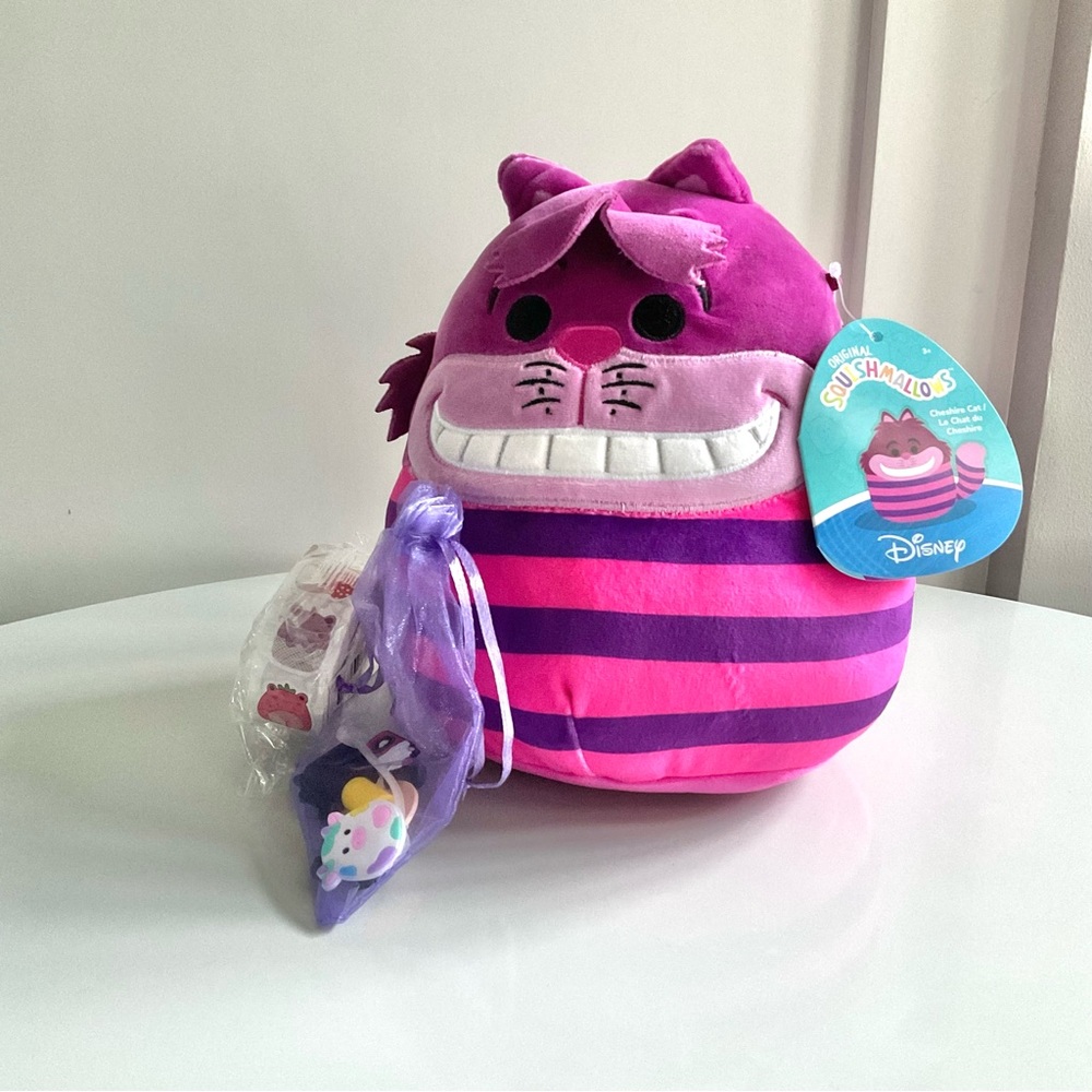 Squishmallow 8" Cheshire Cat. Includes Squishmallow sticker roll/Straw covers
